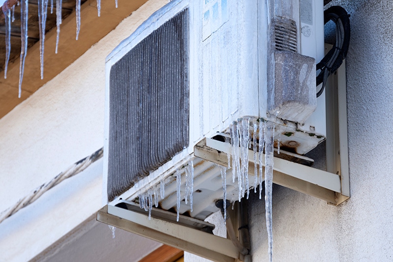 Frozen outdoor heat pump.